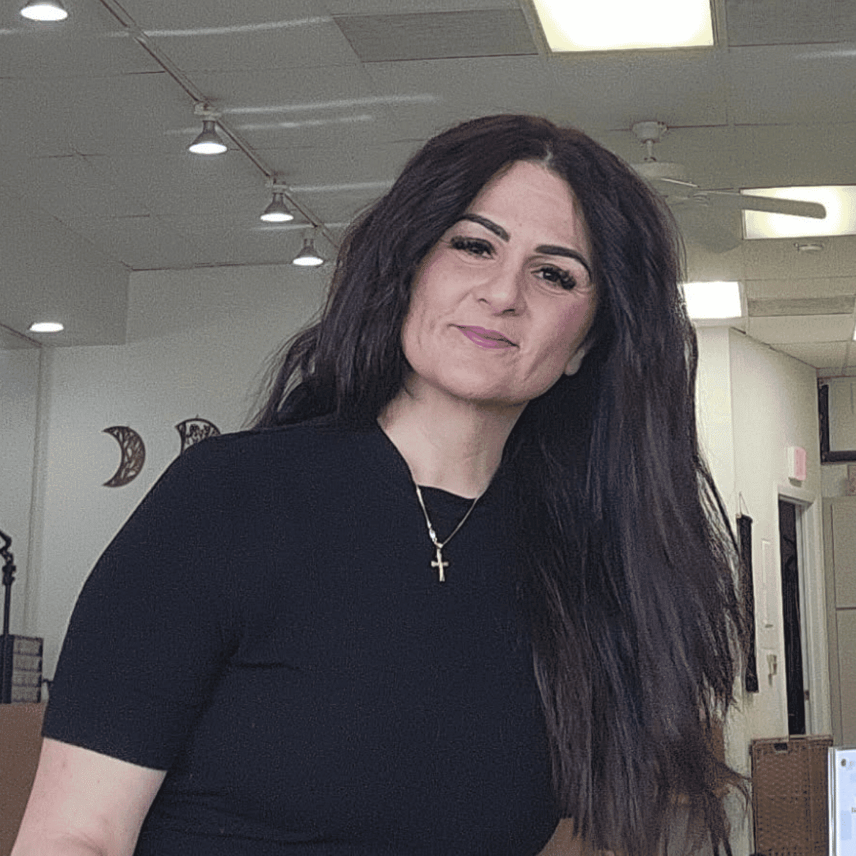 Portrait of Rose, a professional stylist at Dream Hair Studio, showcasing their expertise and style.