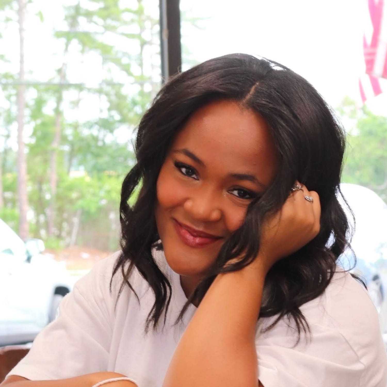 Portrait of Sammy, a professional stylist at Dream Hair Studio, showcasing their expertise and style.