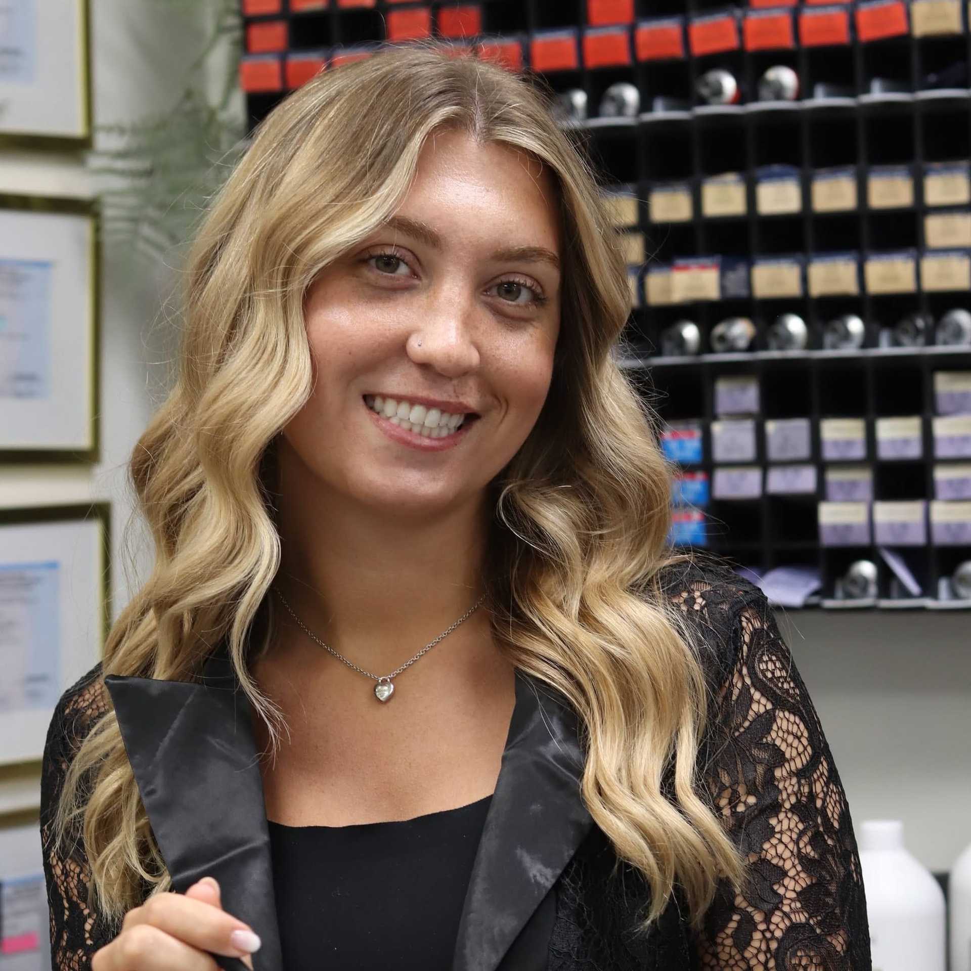 Portrait of Angelina, a professional stylist at Dream Hair Studio, showcasing their expertise and style.