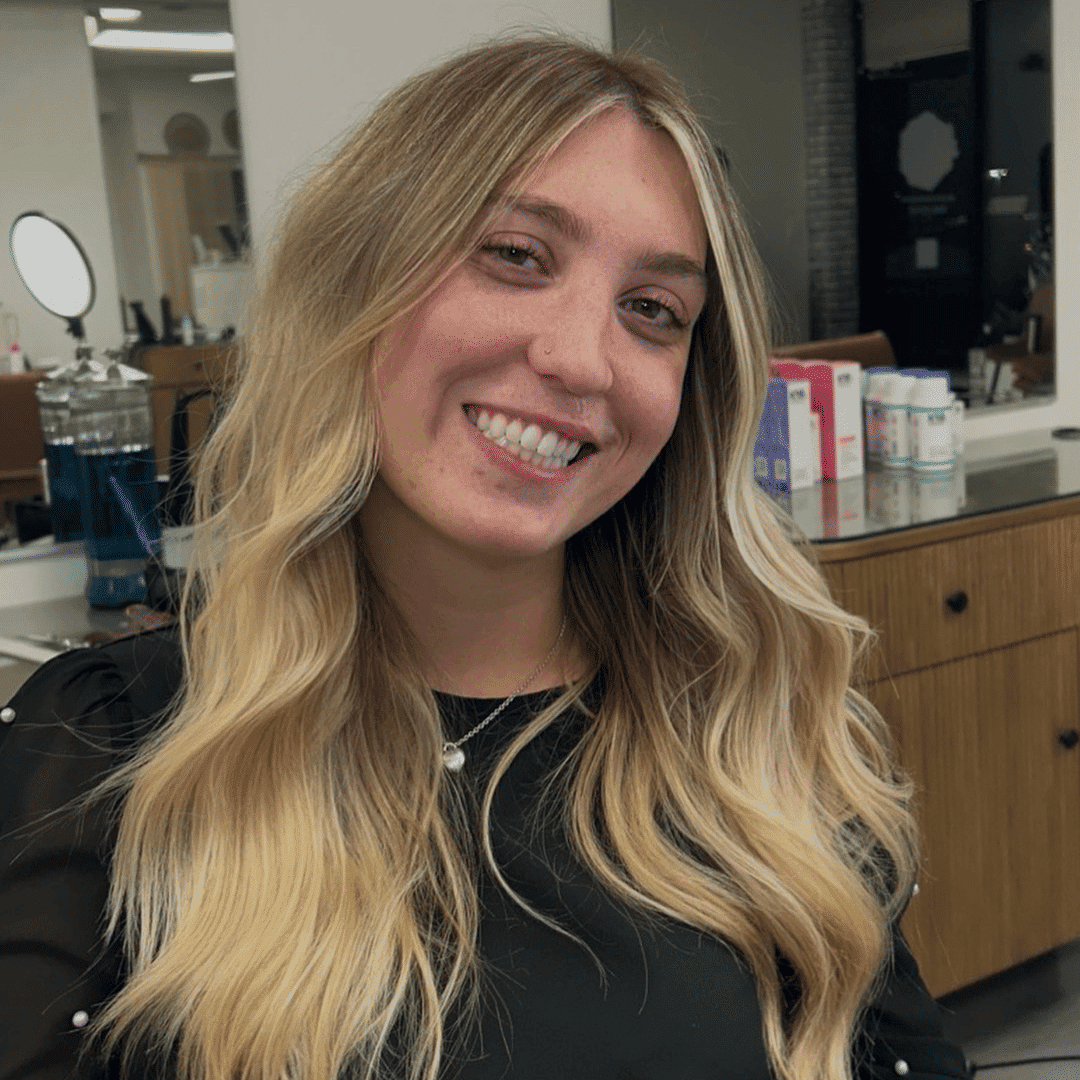 Portrait of Angelina, a professional stylist at Dream Hair Studio, showcasing their expertise and style.