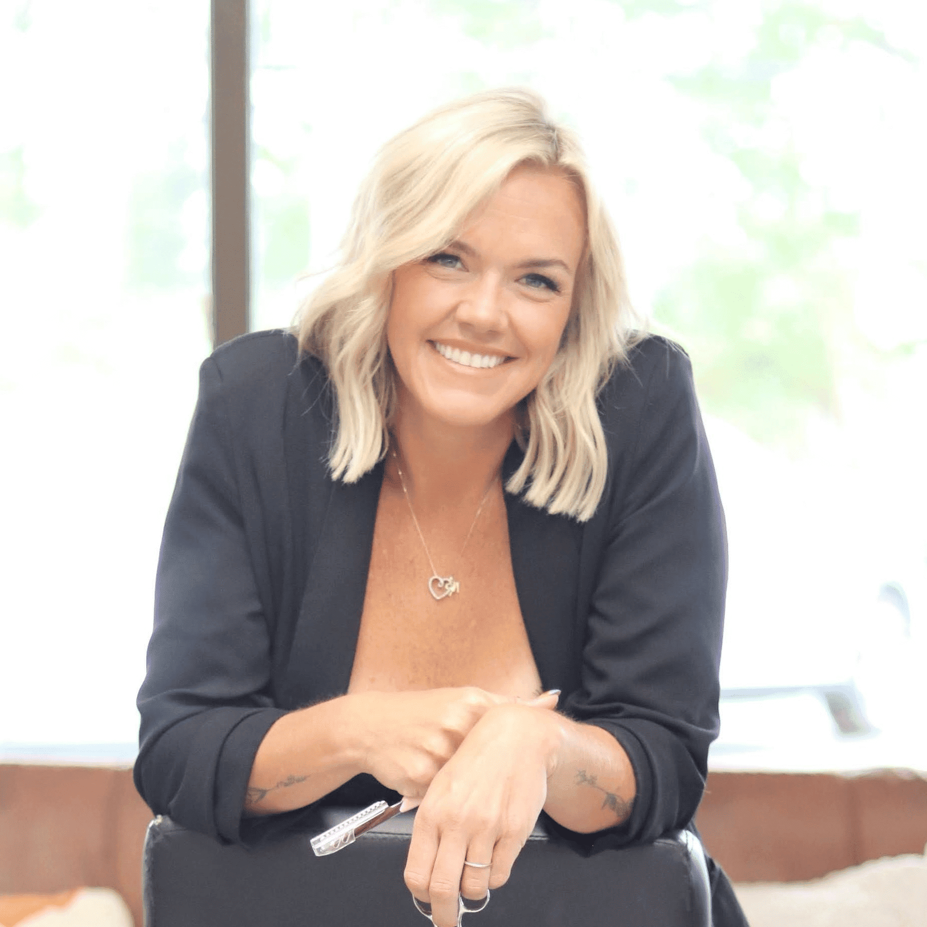 Portrait of Sam, a professional stylist at Dream Hair Studio, showcasing their expertise and style.